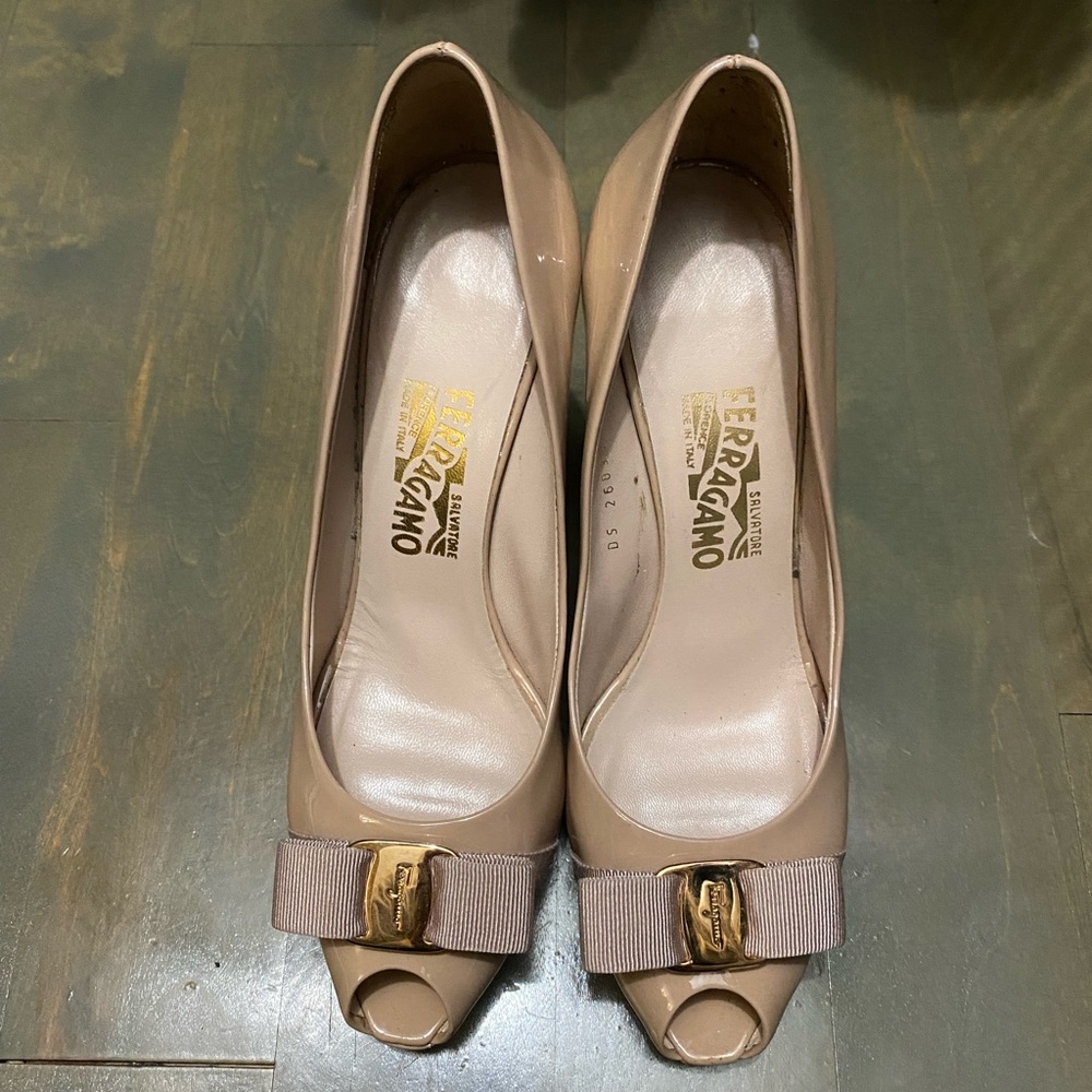 Used authentic Salvatore Ferragamo peep toe nude patent leather heels.